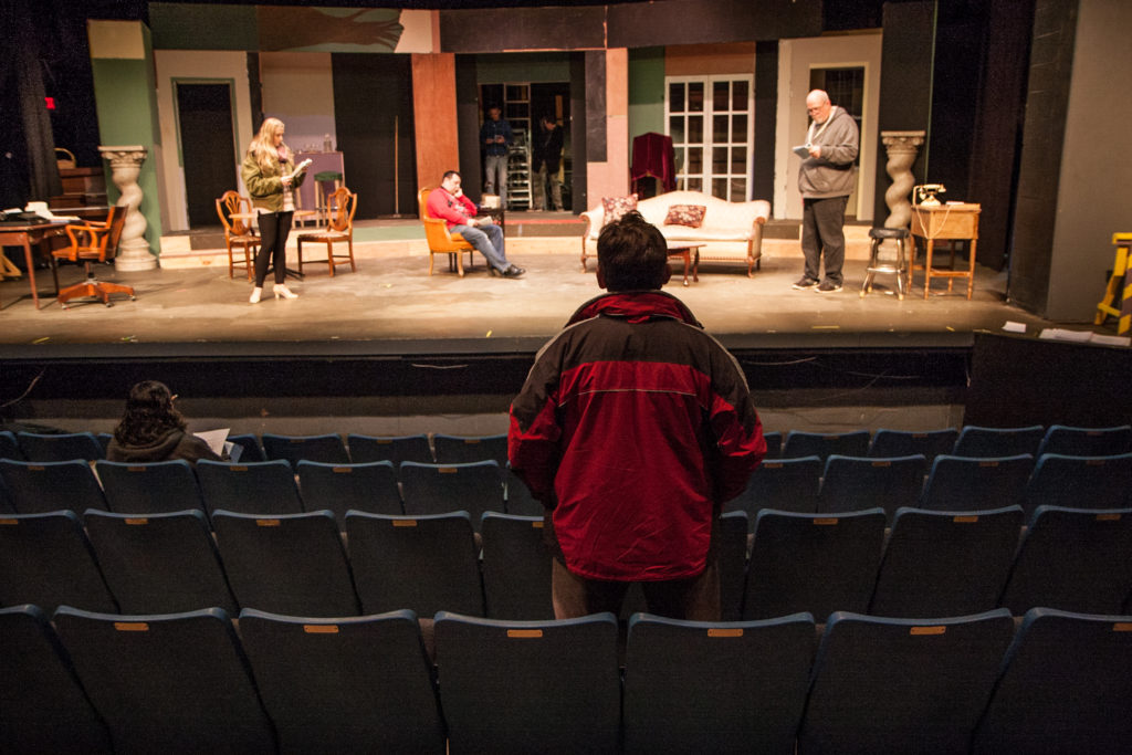 watching rehearsal from audience