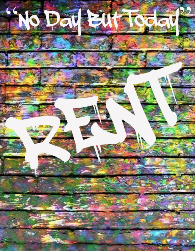 the word rent spray painted on a wall